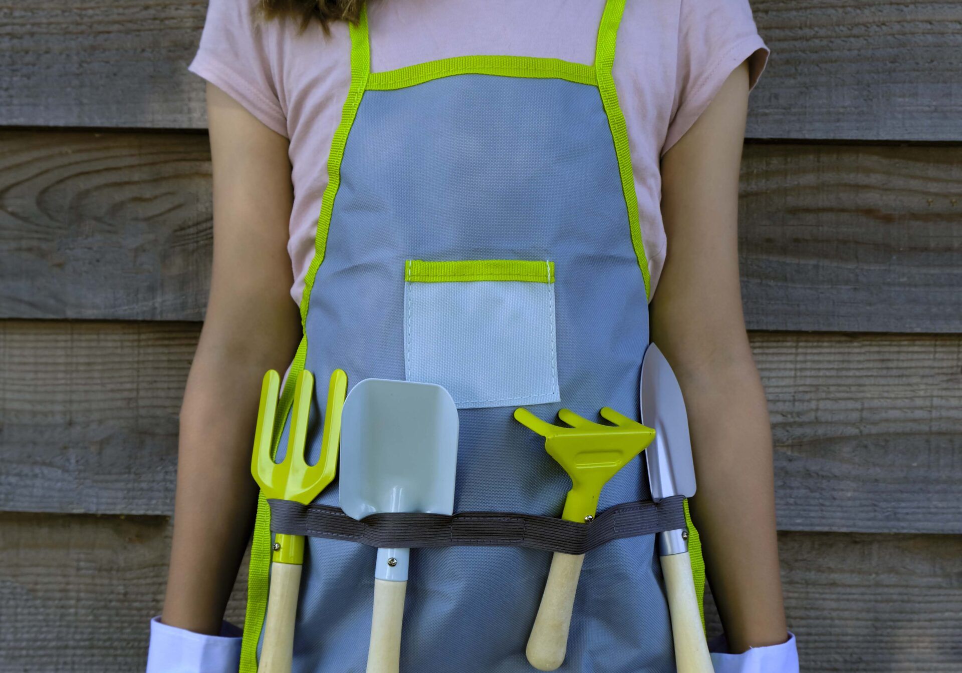 kid with garden tools