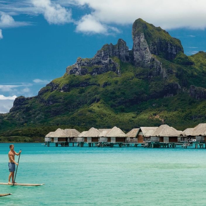 Jetski in Bora Bora with overwater bungalows