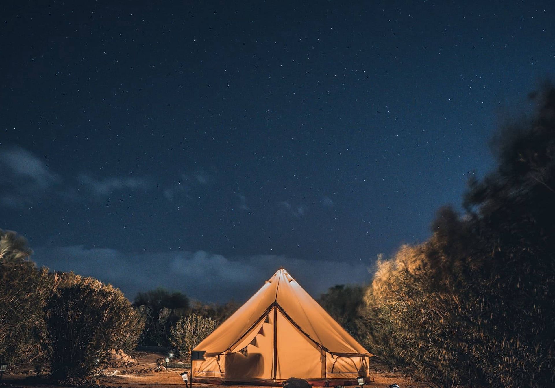 A Teepee in the woods and the starry sky