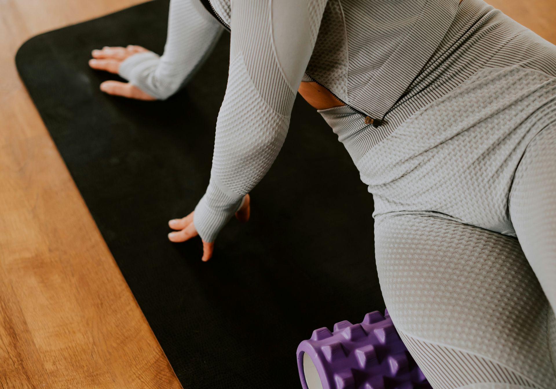 woman exercising on floor gym mat