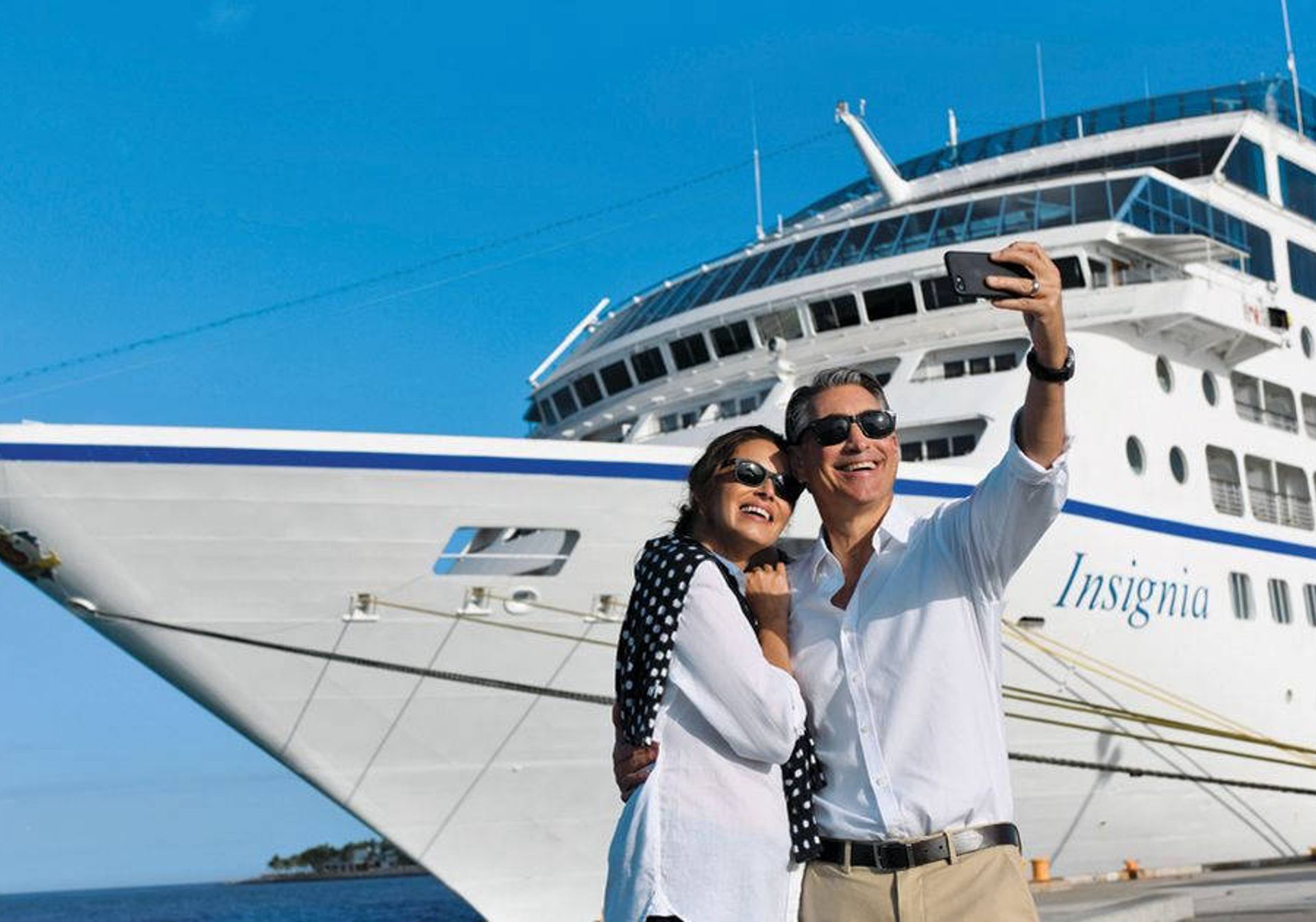 a couple in front of the cruise