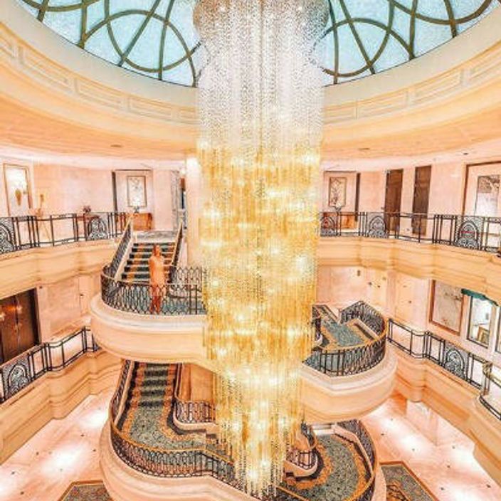 a girl inside the shangri la hotel in Istanbul on a staircase
