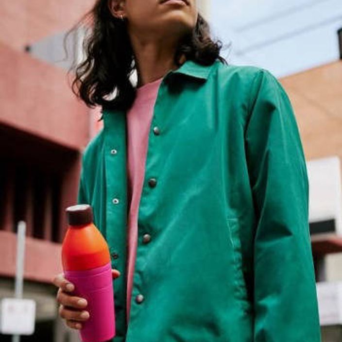 a man holding a thermal water bottle