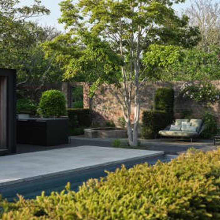 Beautiful stone decking and a landscaped garden