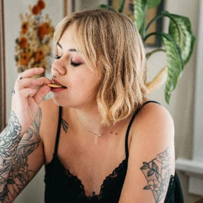 Woman eating a cookie