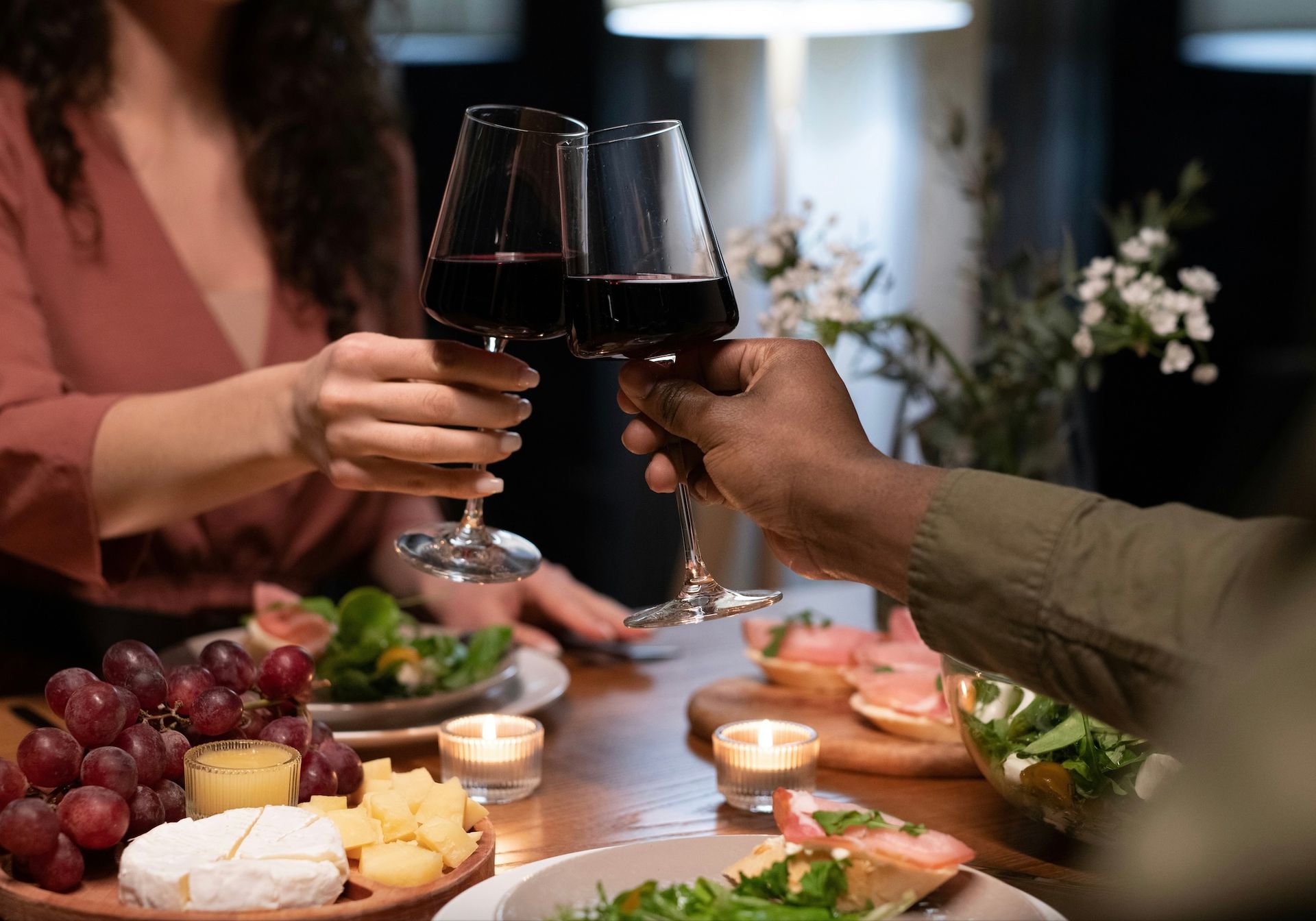 two people at dinner drinking wine