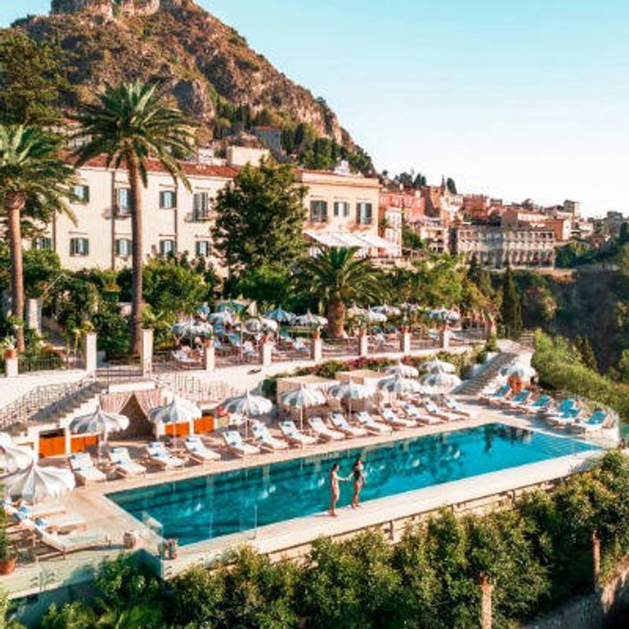 jennifer coolidge in front of her vespa