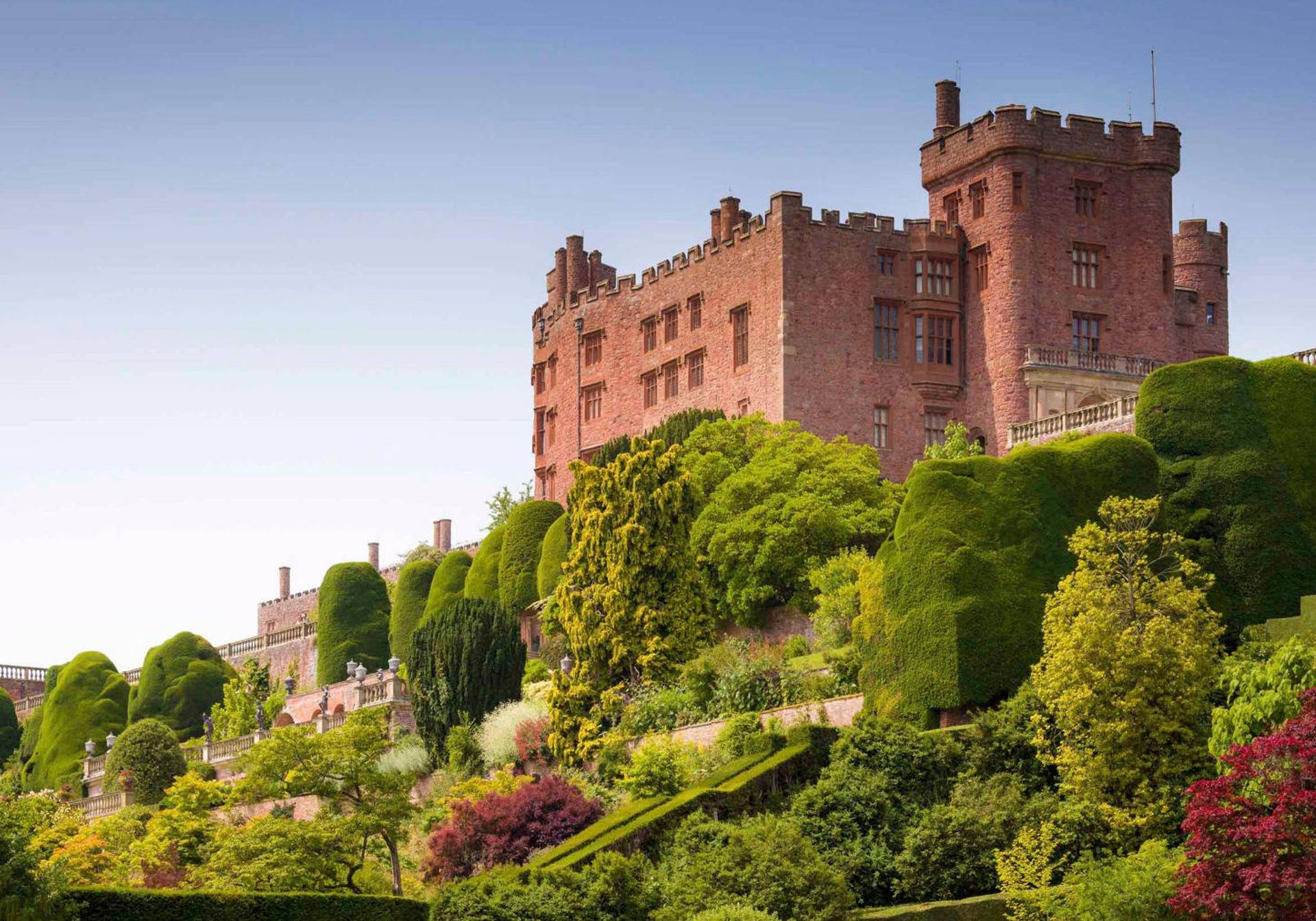 a castle that is part of the national trust in an autumn landscape