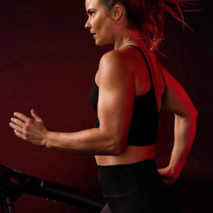 girl running in Barry's bootcamp gear