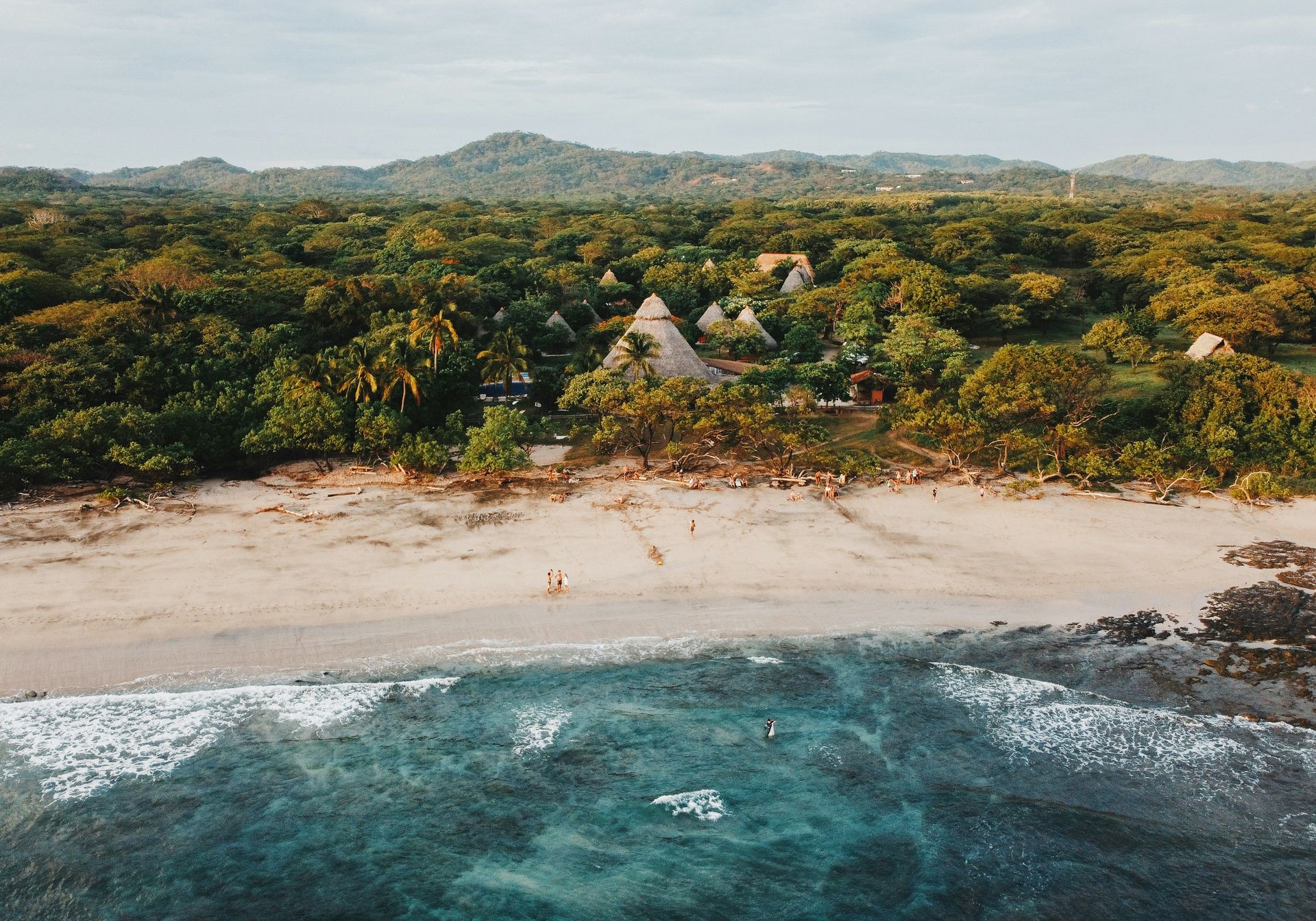 A girl looks out at Manuel Antonio National Park beach