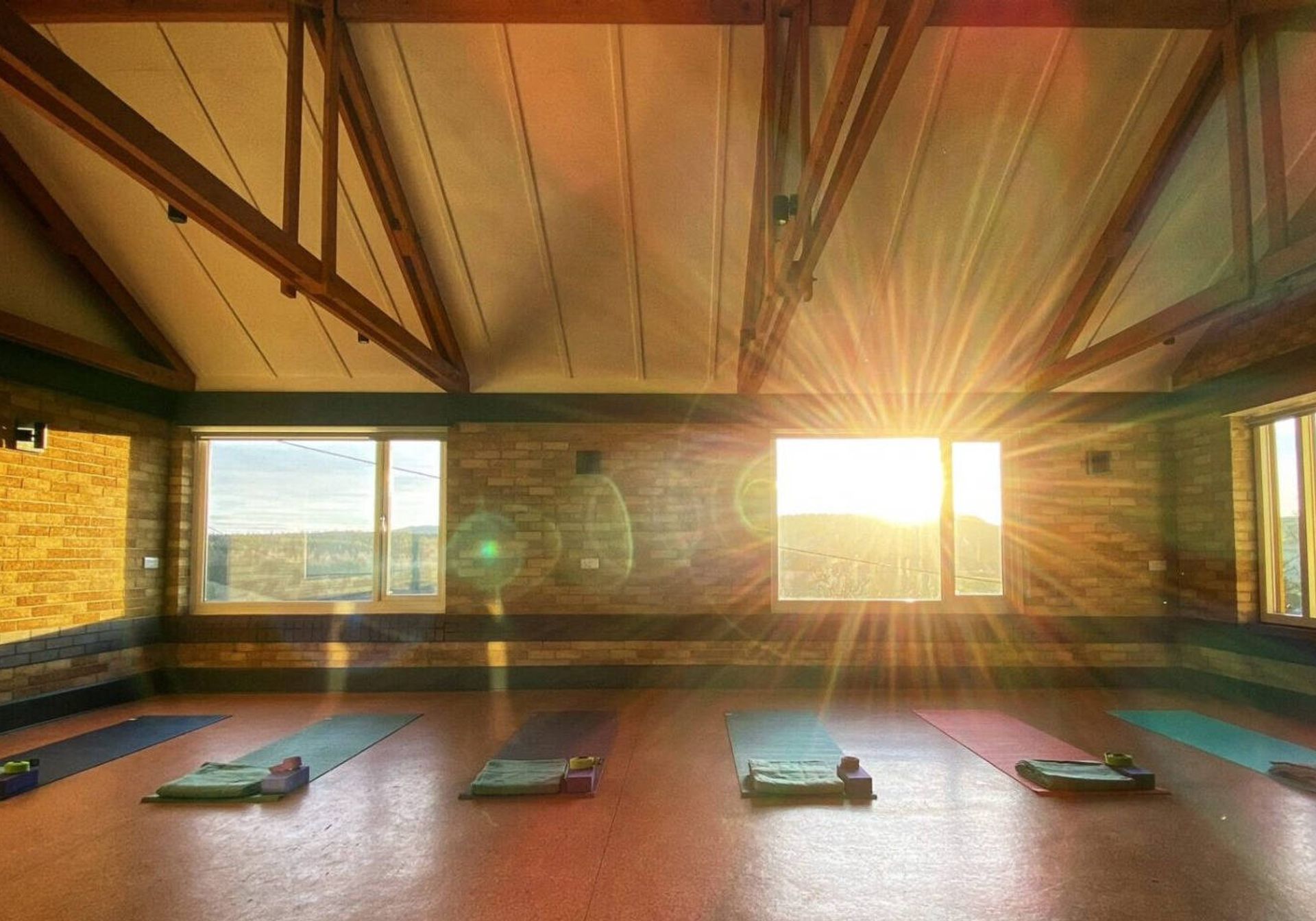 yoga room with the sun shining through the window