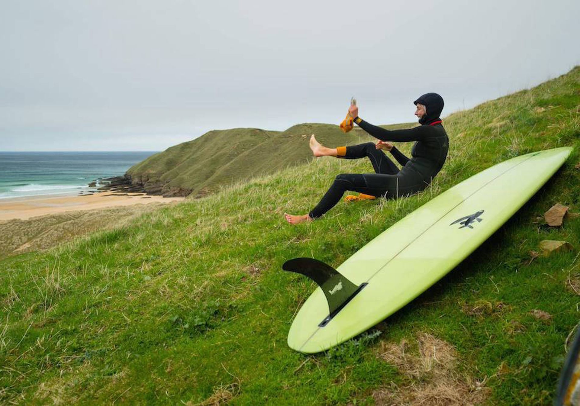 Person on hill with surf board