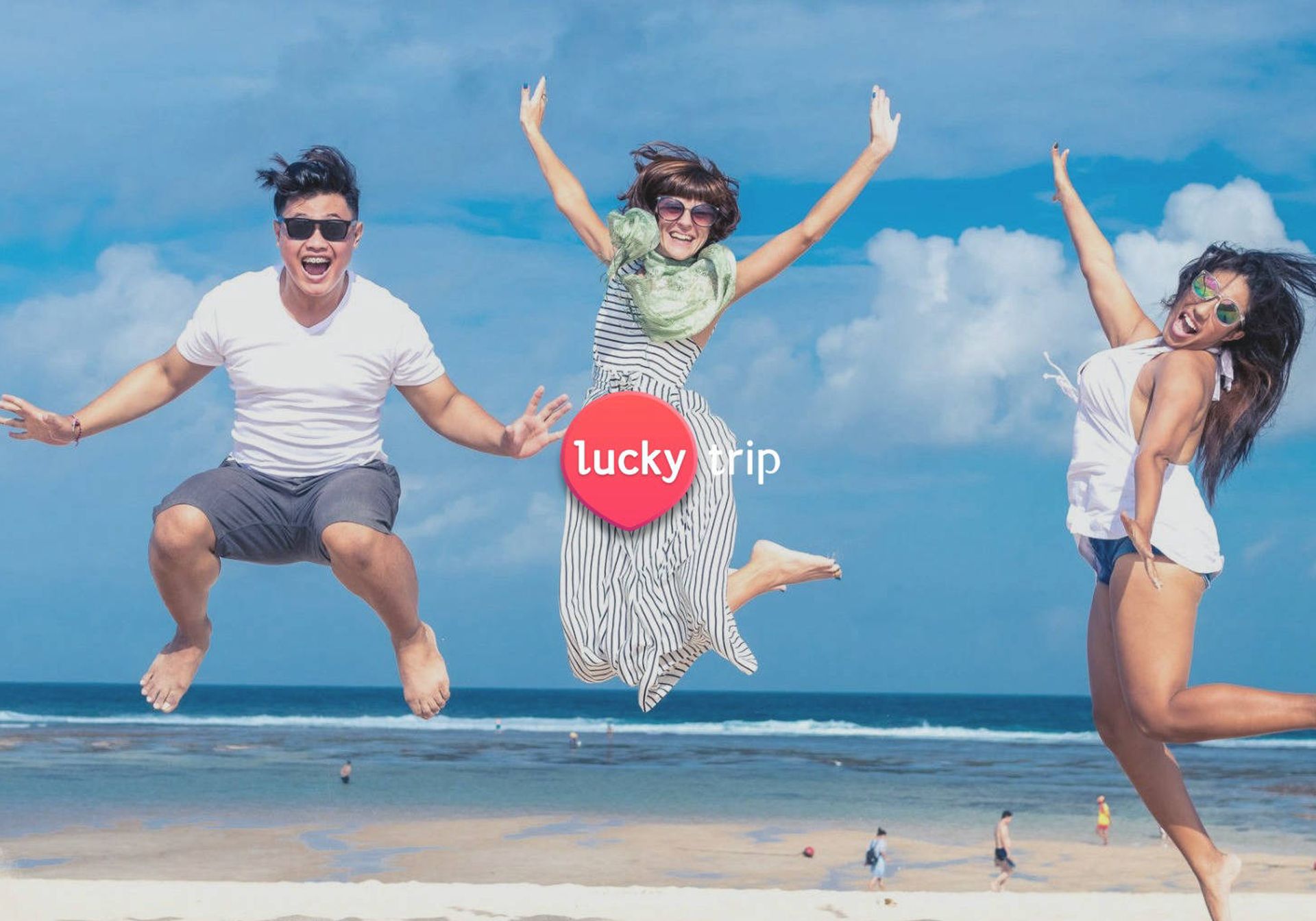 Three friends jumping on the beach
