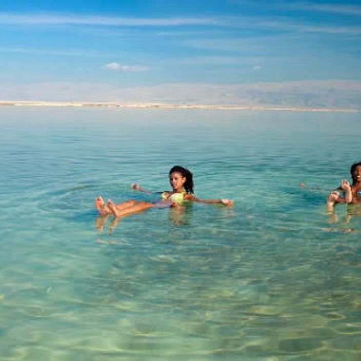 women swimming in dead sea