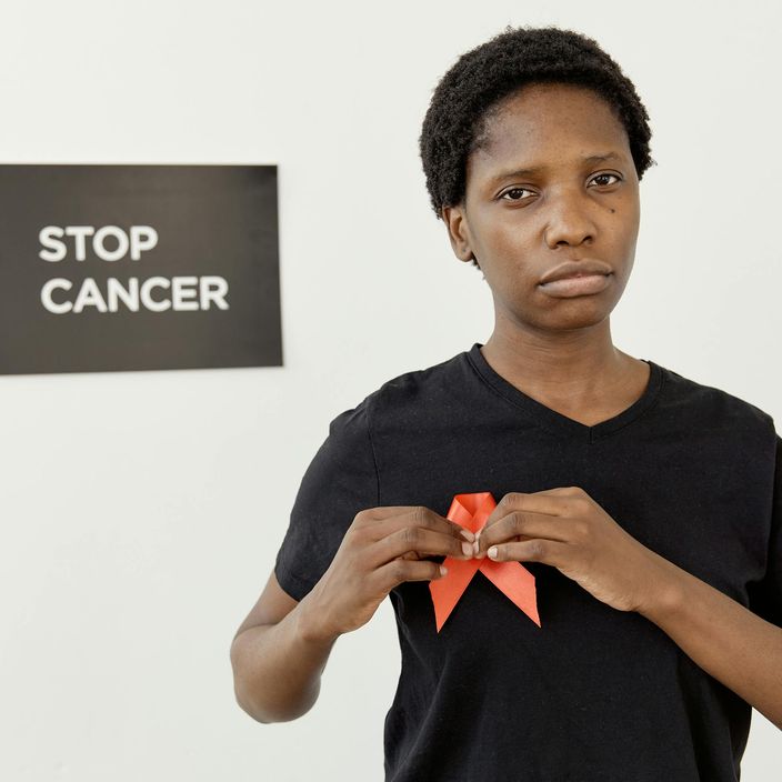 People with their hands in a circle on top of each other