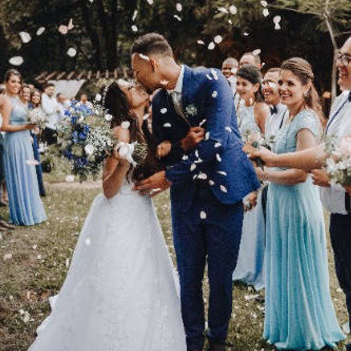 a man and a woman laughing who just got married