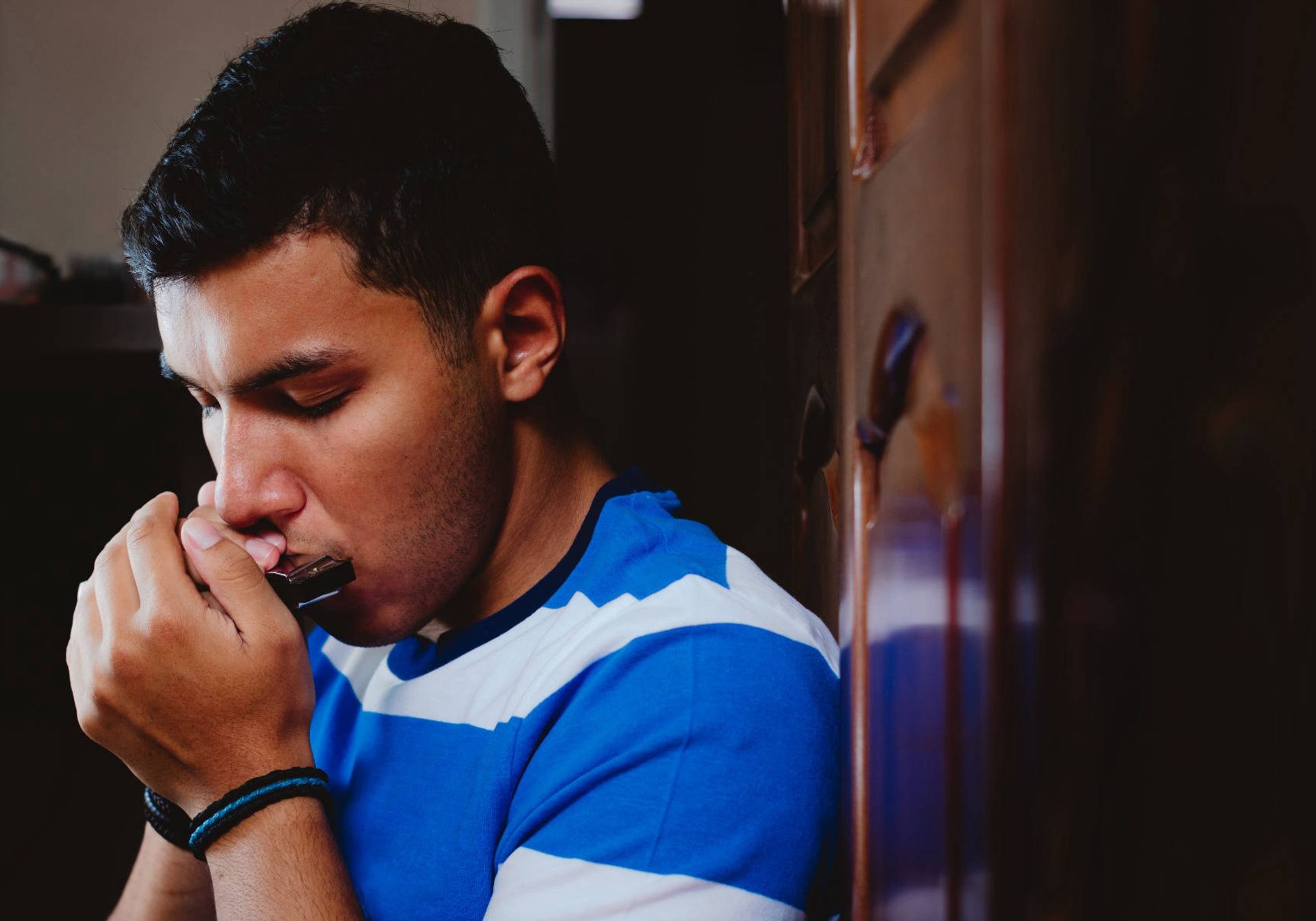 Man playing the harmonica