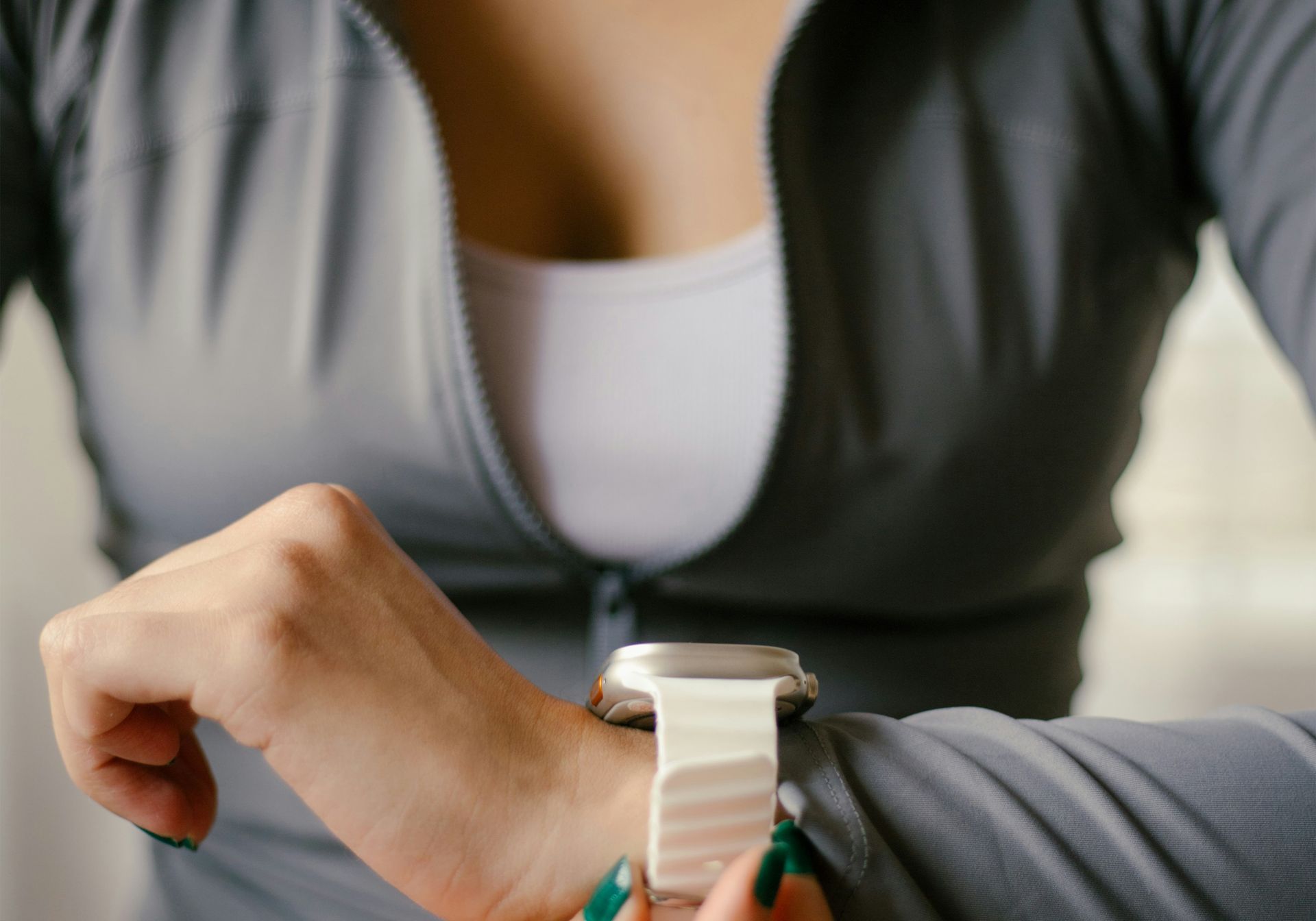 woman checking health device watch