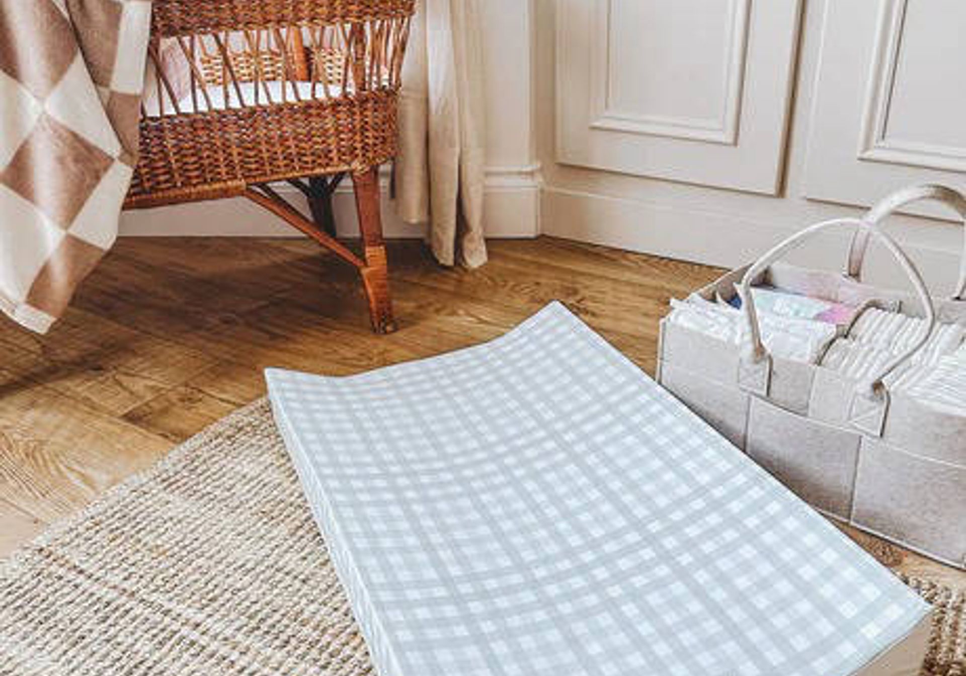 The little bumble co. anti roll changing mat in a nursery