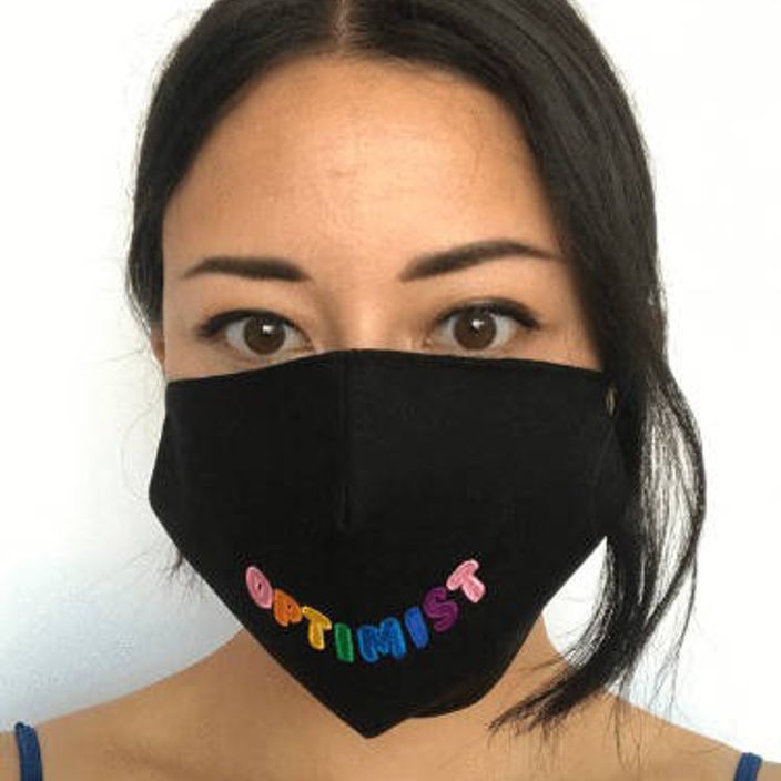 Woman with black Birdsong Optimist face mask