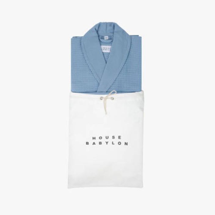 Blue bathrobe in white bag