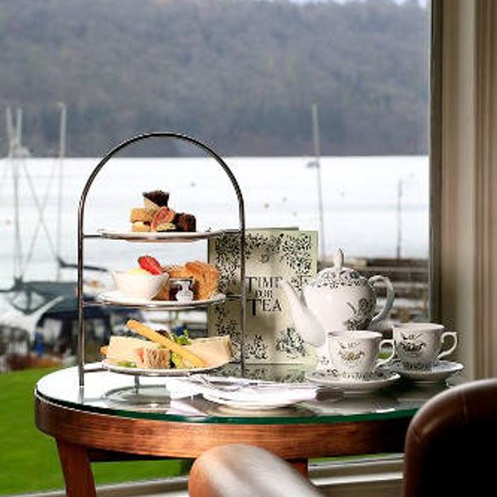 an afternoon tea with cakes and tea