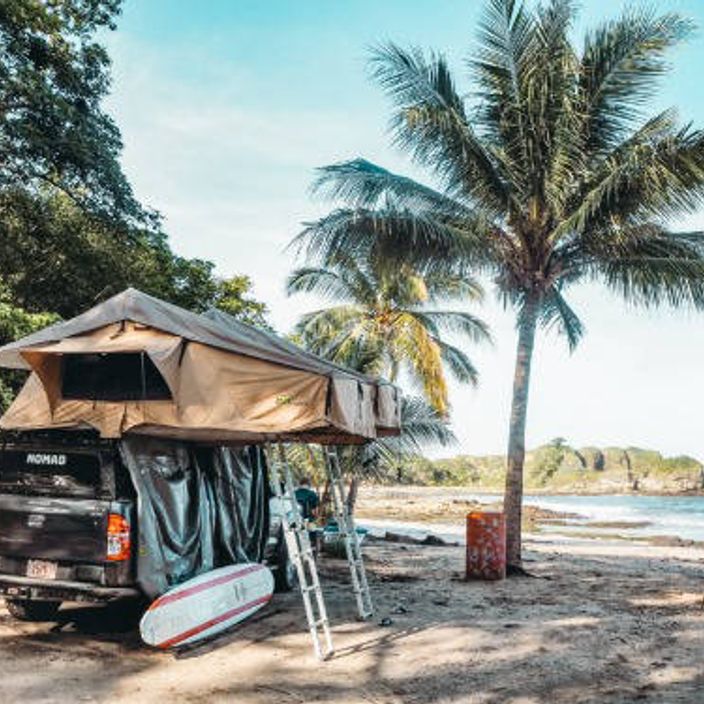 A 4x4 parked on a beach in Costa Rica