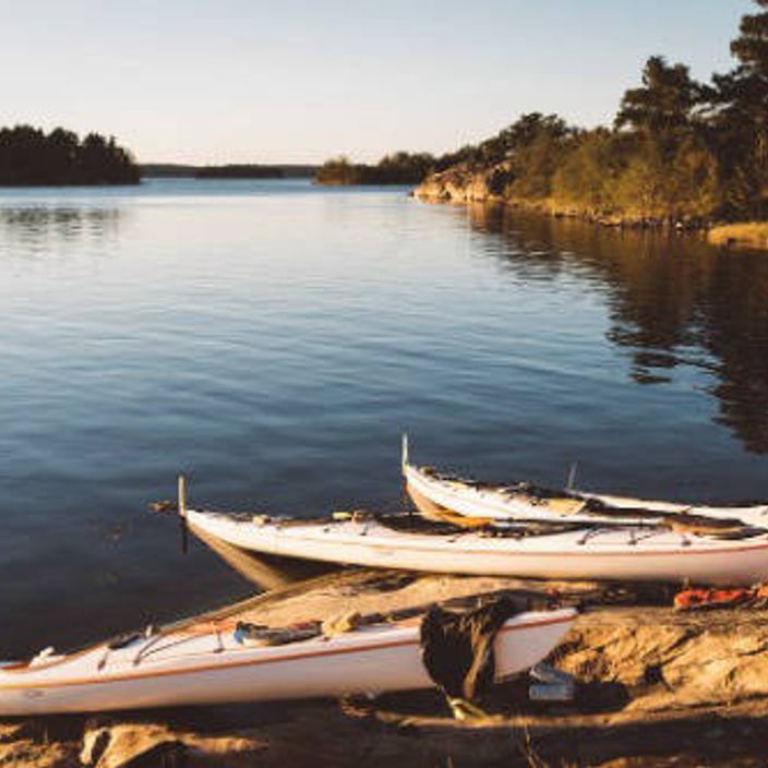 Kayaks on the bank of Sweden's archipelago