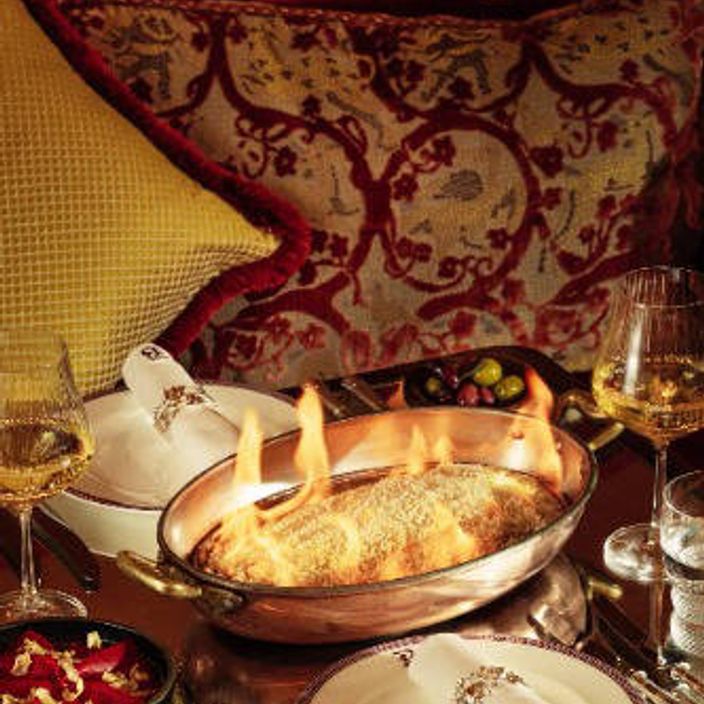 a photo of a flambe fish at Bacchanalia