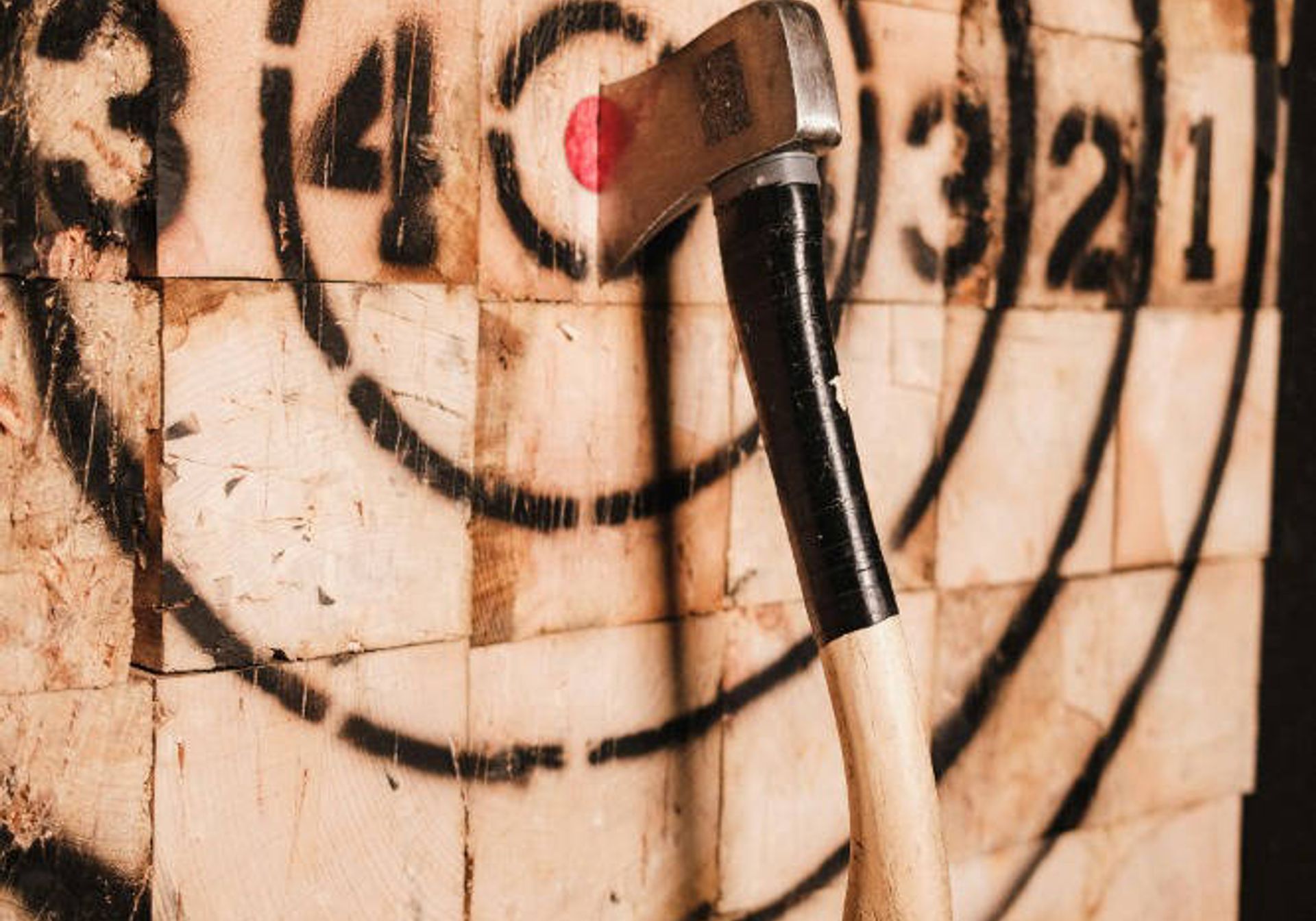 Axe board with axe on the bullseye
