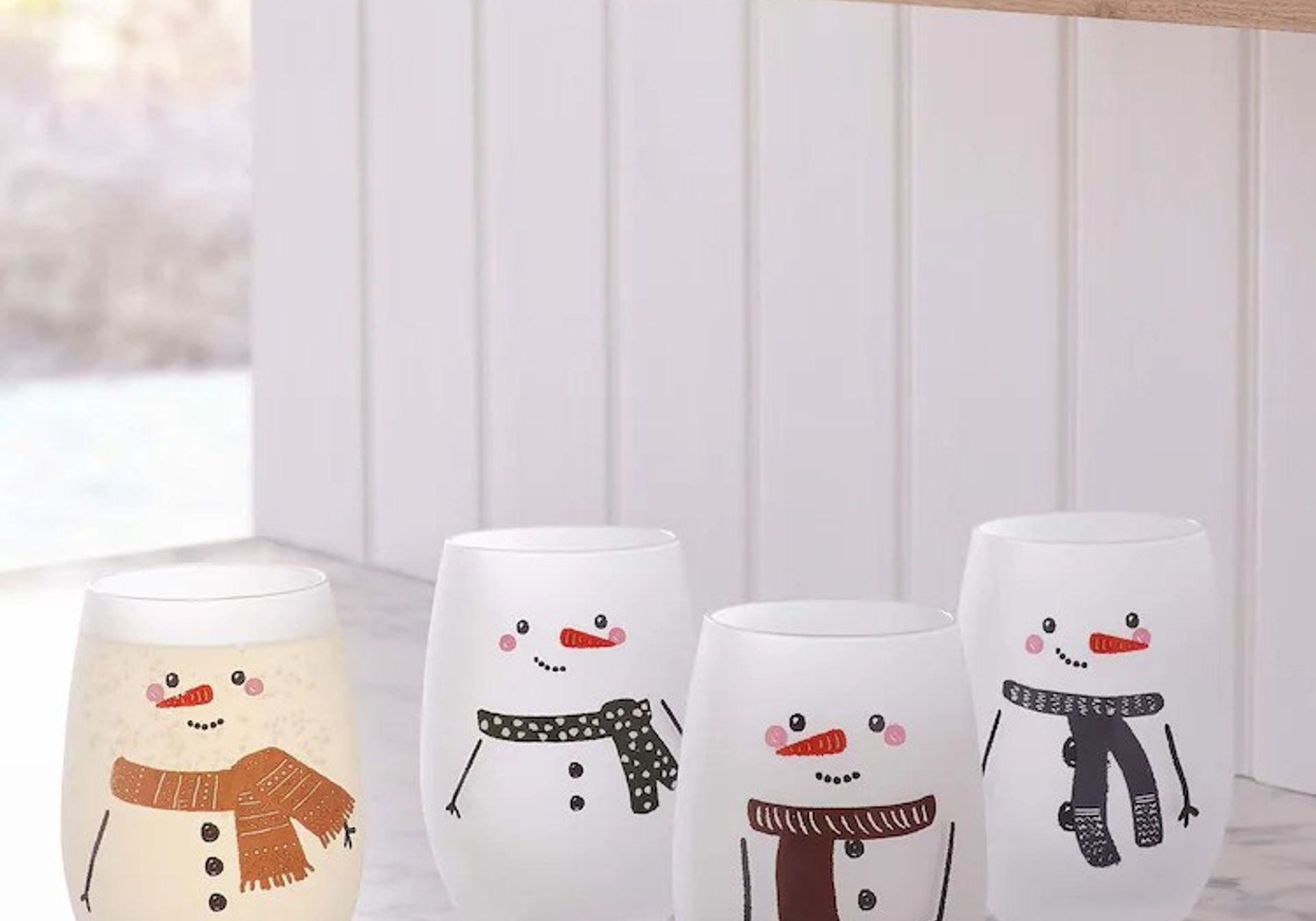 four snowman tumbler glasses