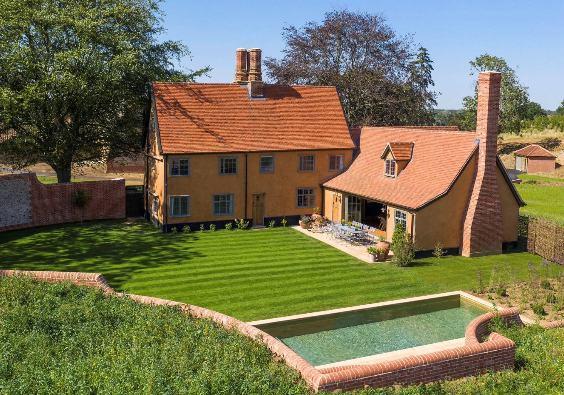 Beautiful Traditional Suffolk Farmhouse exterior with pool