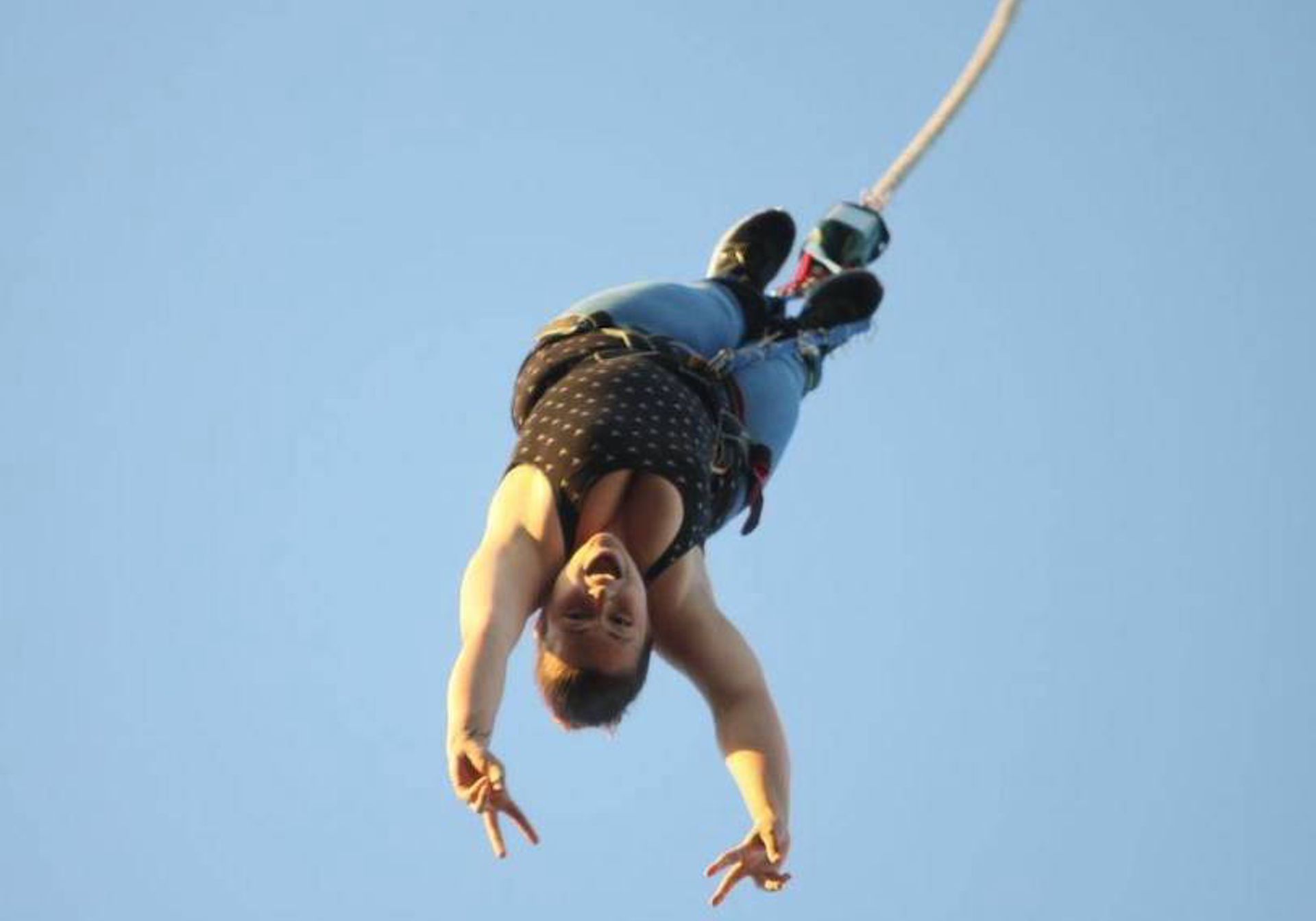 Woman bungee jumping