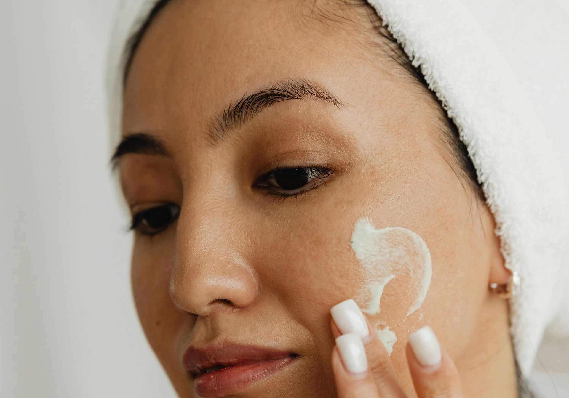 woman applying skincare