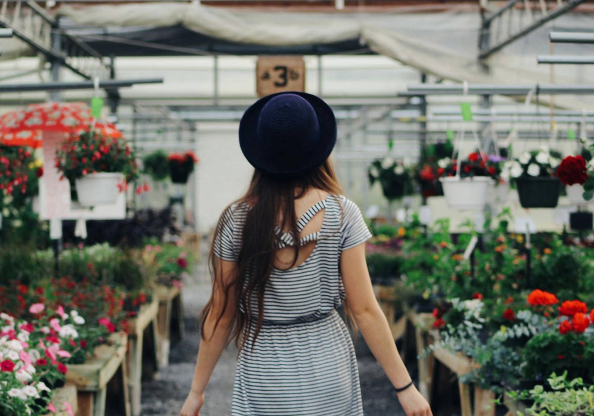 a women walking in a garden centre