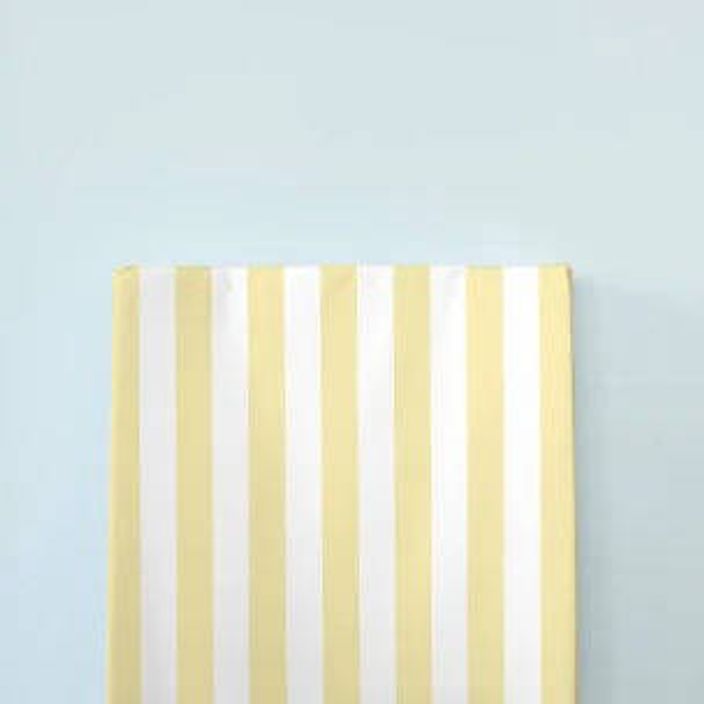 The little bumble co. anti roll changing mat yellow stripe blue background