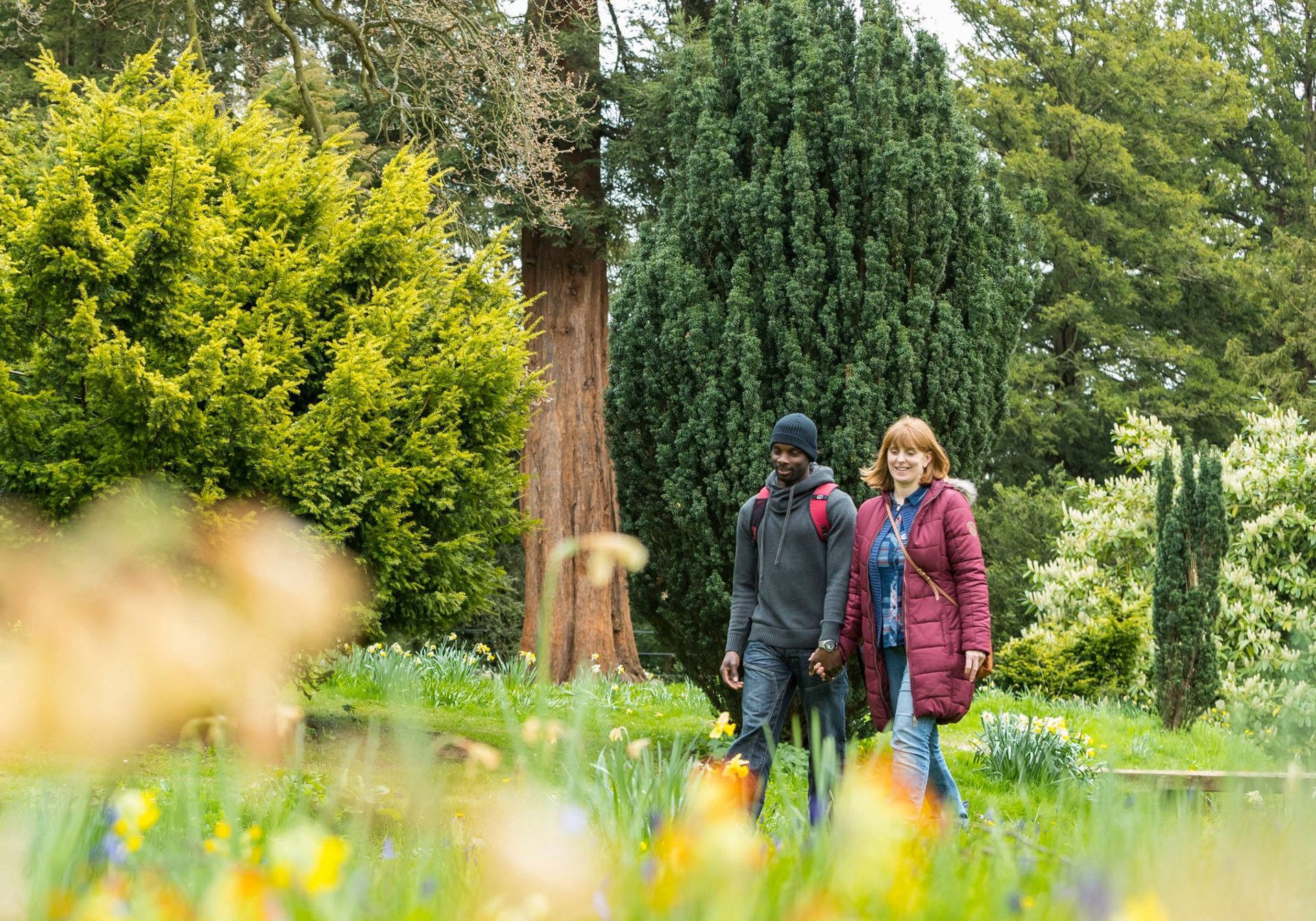 a couple walking around a National Trust grounds