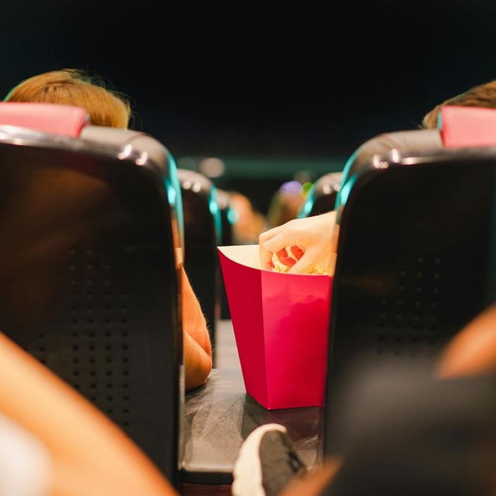 Friends laughing at the cinema