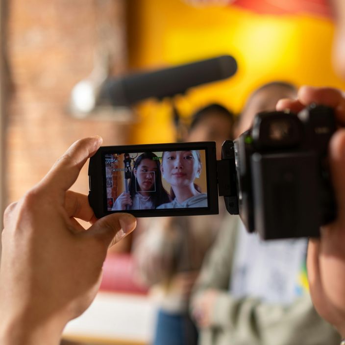 red hand held Camera For Recording 1080P