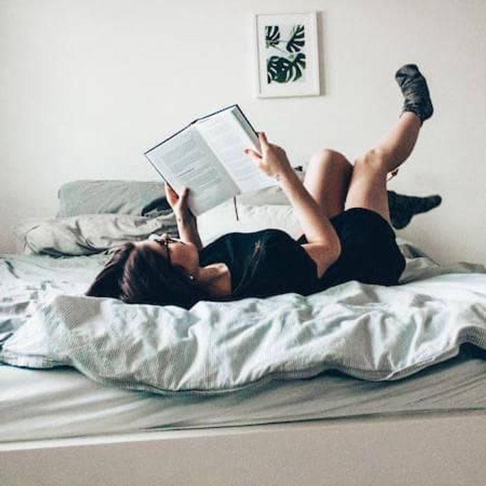 Woman reading on bed