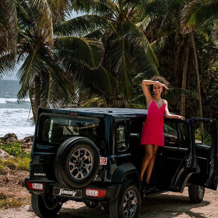 woman in suzuki jimny