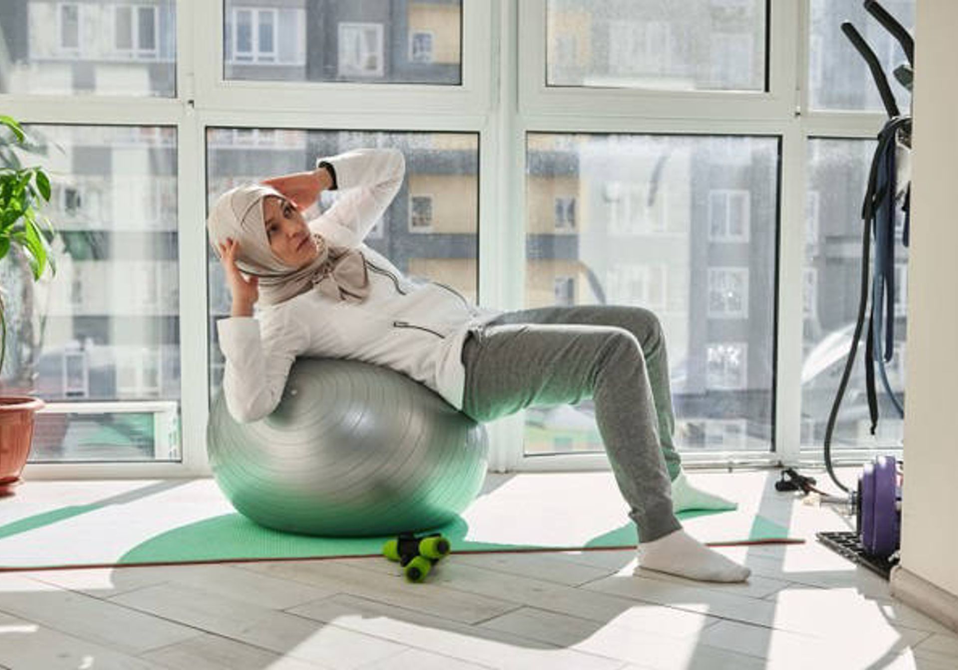 Woman in gym with weights