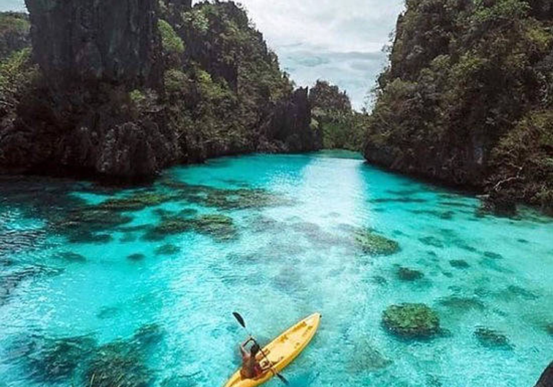 Canoe in blue water lagoons