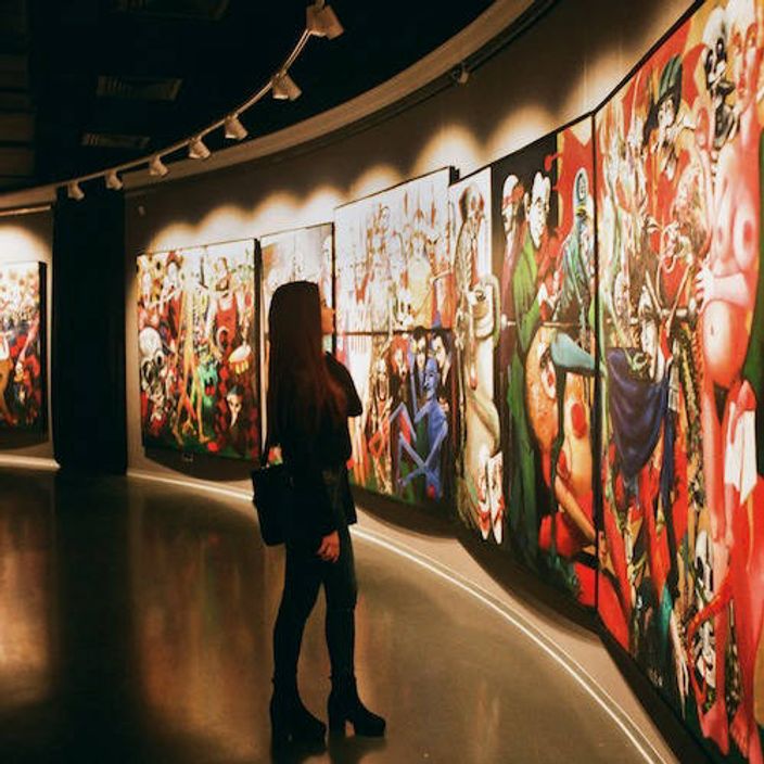 Woman viewing art in a gallery