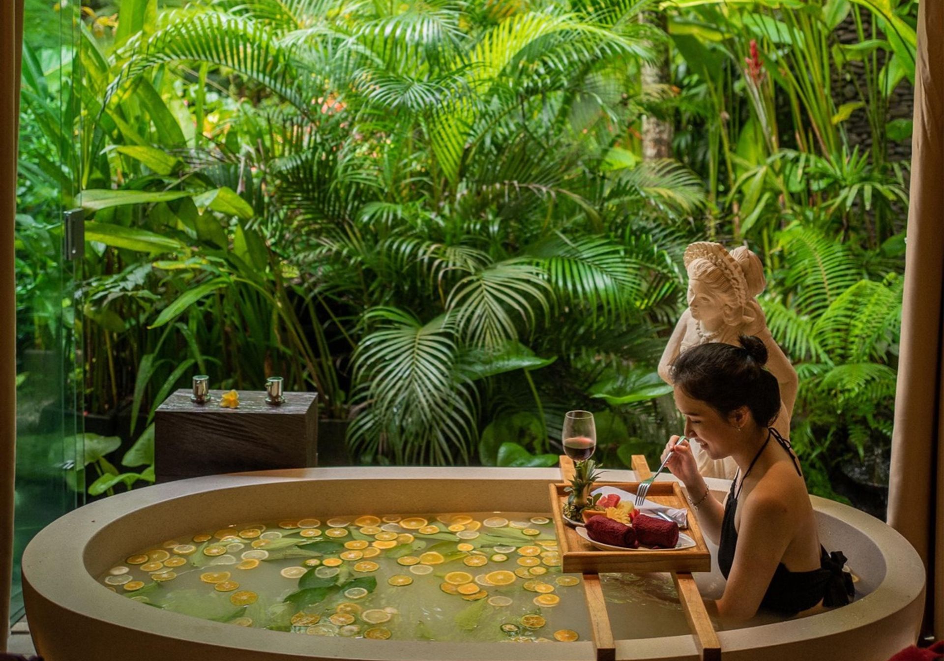 girl in bath in bali udaya resort