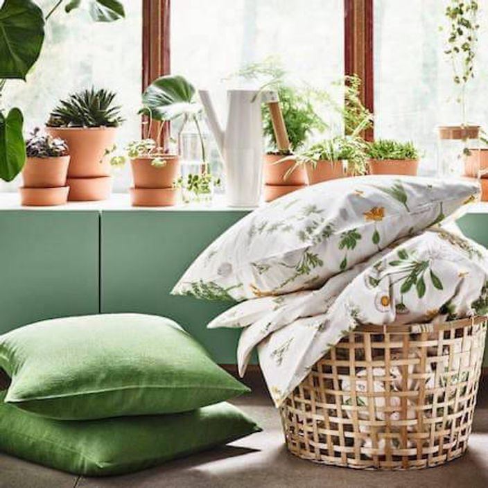 Bright living room with green floral linens