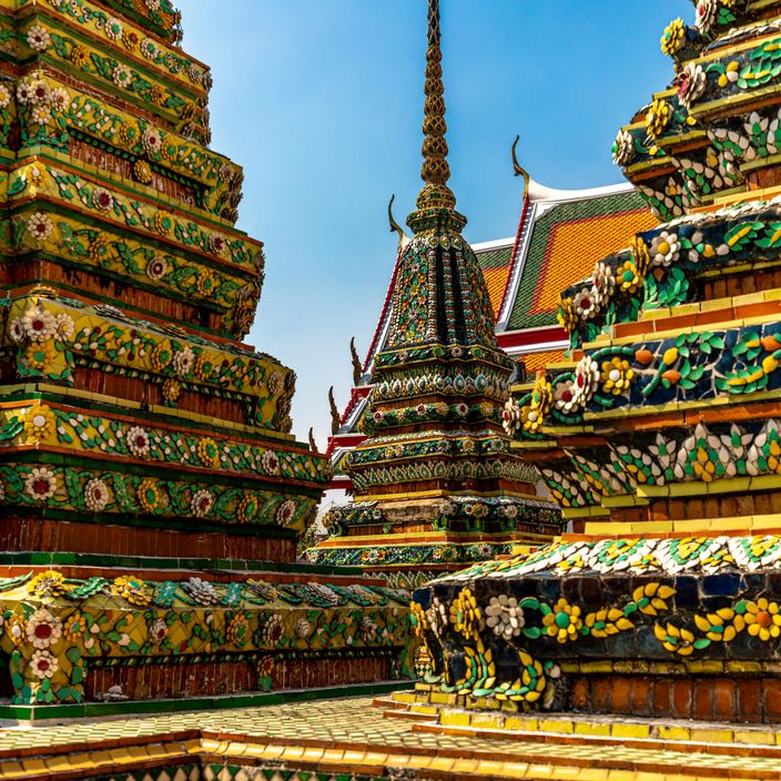 Woman with boat on blue sea in Thailand